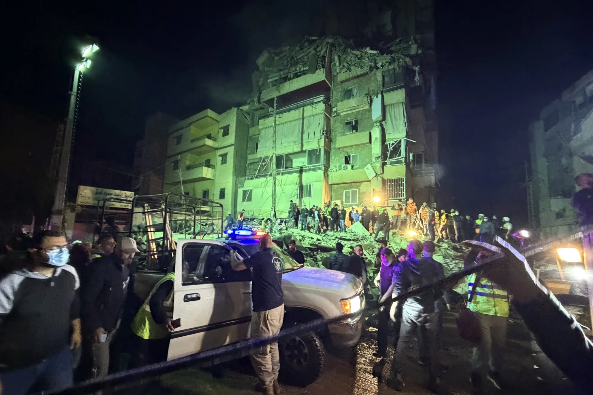 People gather at the site of an Israeli airstrike that targeted Beirut’s southern suburbs Haret Hreik neighborhood on May 6.
