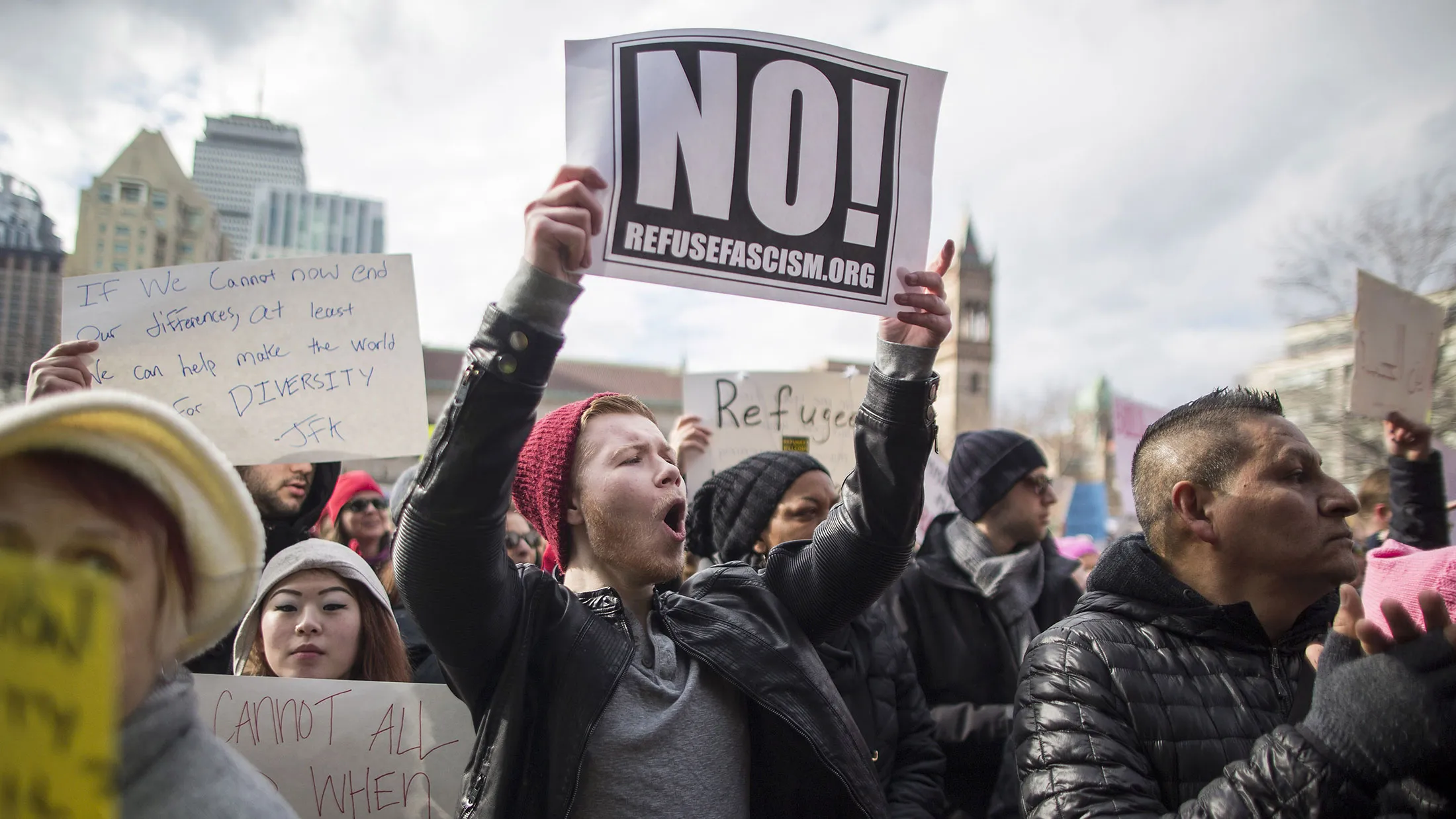 Demonstrators hold signs and chant in Boston’s Copley Square protesting President Donald Trump’s executive order blocking visitors from seven predominantly Muslim nations on Jan. 29, 2017.
