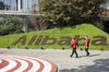 Employees walk through the campus at the Alibaba Group Holding Ltd. headquarters during the annual November 11 Singles' Day online shopping event in Hangzhou, China, on Monday, Nov. 11, 2019. Alibaba's Singles' Day shopping bonanza got off to a scorching start, logging more than 114 billion yuan ($16.3 billion) of purchases in less than 90 minutes, the equivalent of more than half of last year’s record haul for the 24-hour event.