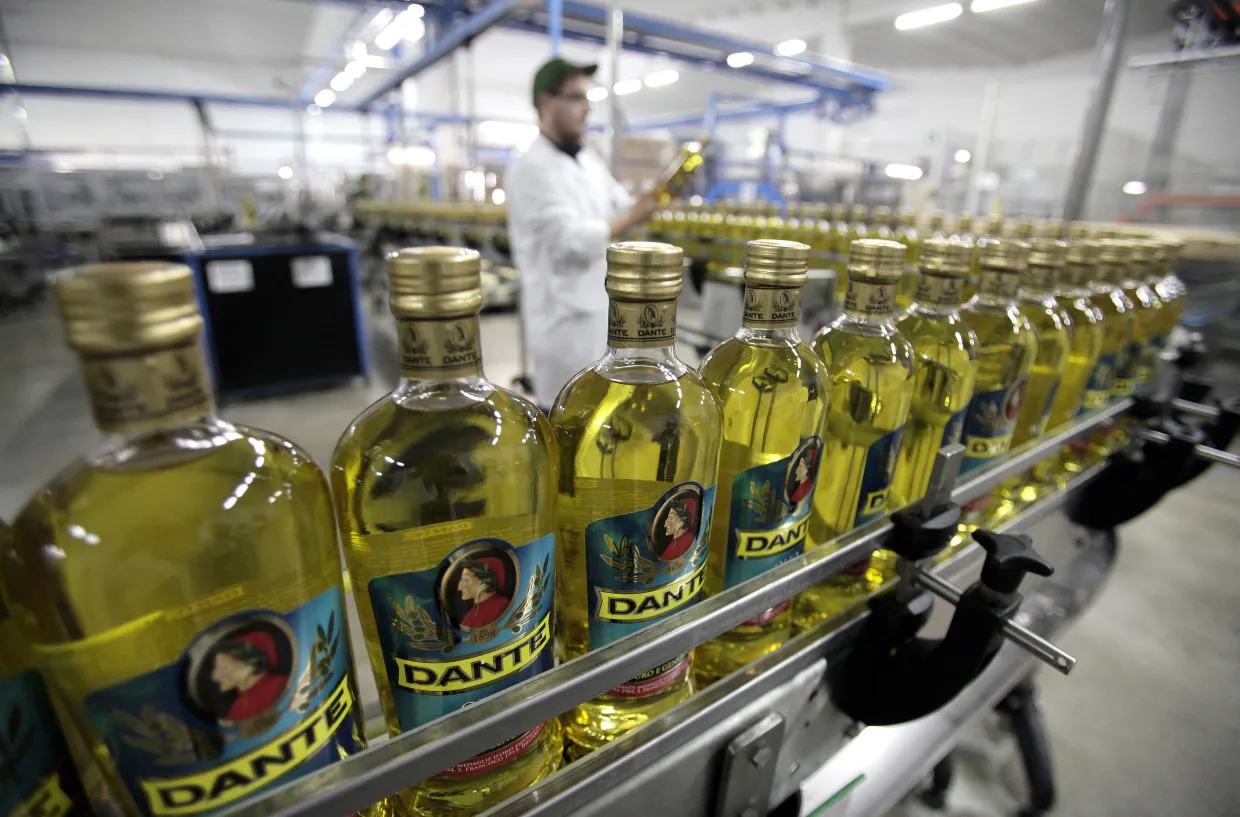 Bottles of Dante olive oil in production at a factory near Benevento, Italy.