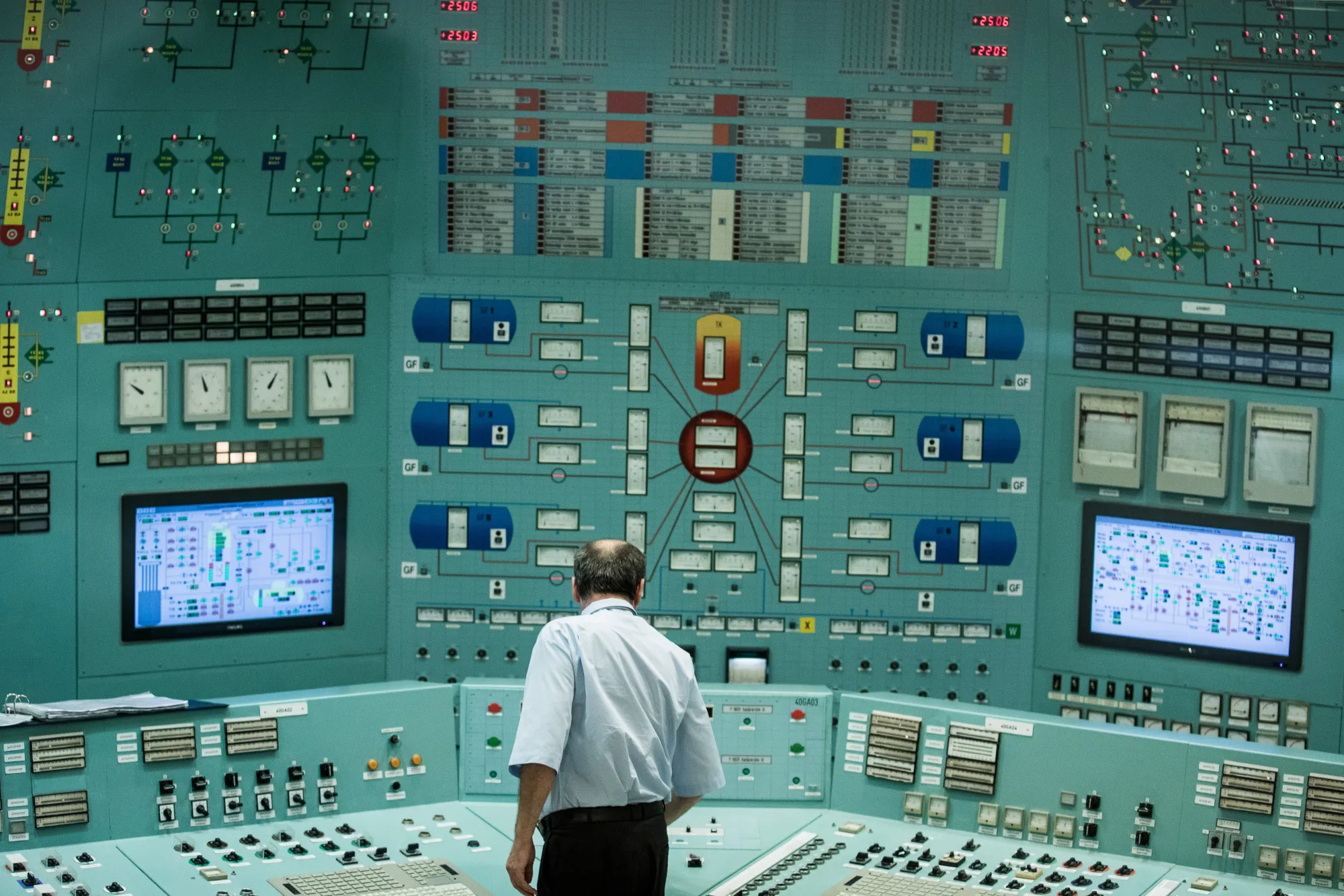 An employee inspects instrument panels in the control room inside the Paks nuclear power plant in&nbsp;Hungary.
