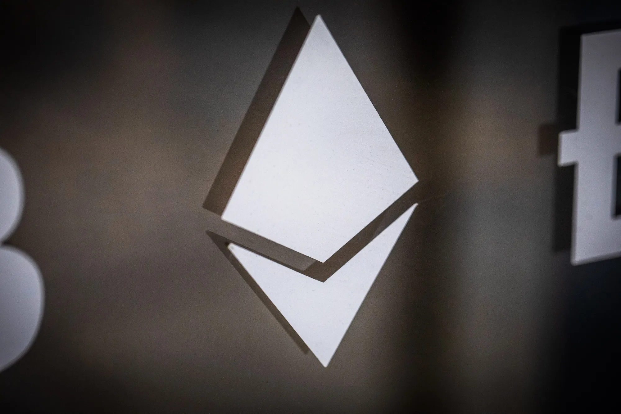 An Ethereum logo on the window of a cryptocurrency exchange in Barcelona.