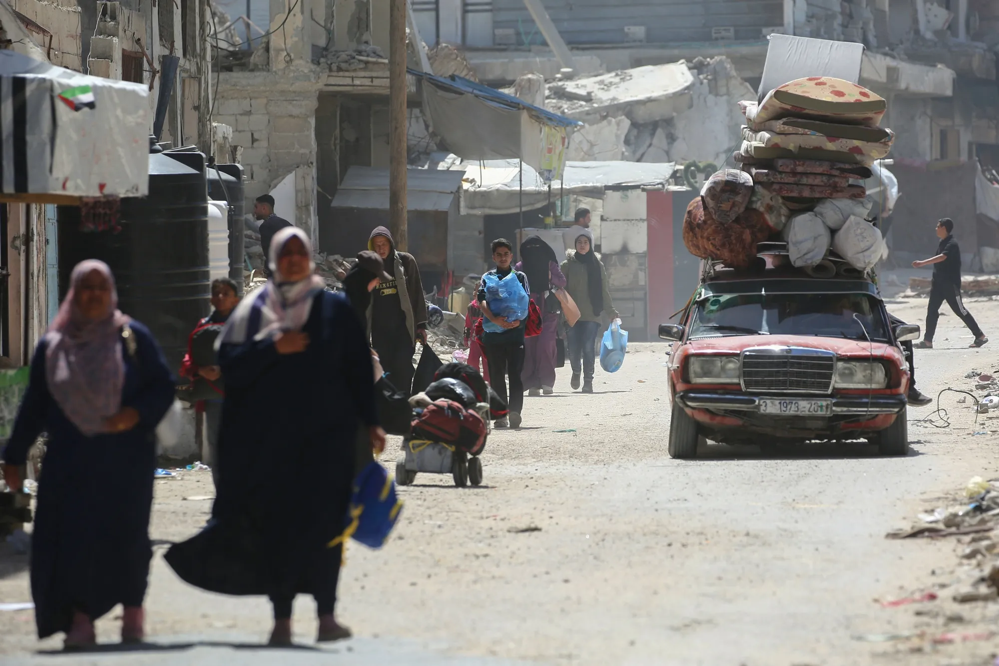 People fleeing Rafah arrive in Khan Yunis city following new Israeli evacuation orders, in the southern Gaza Strip, on March 31.