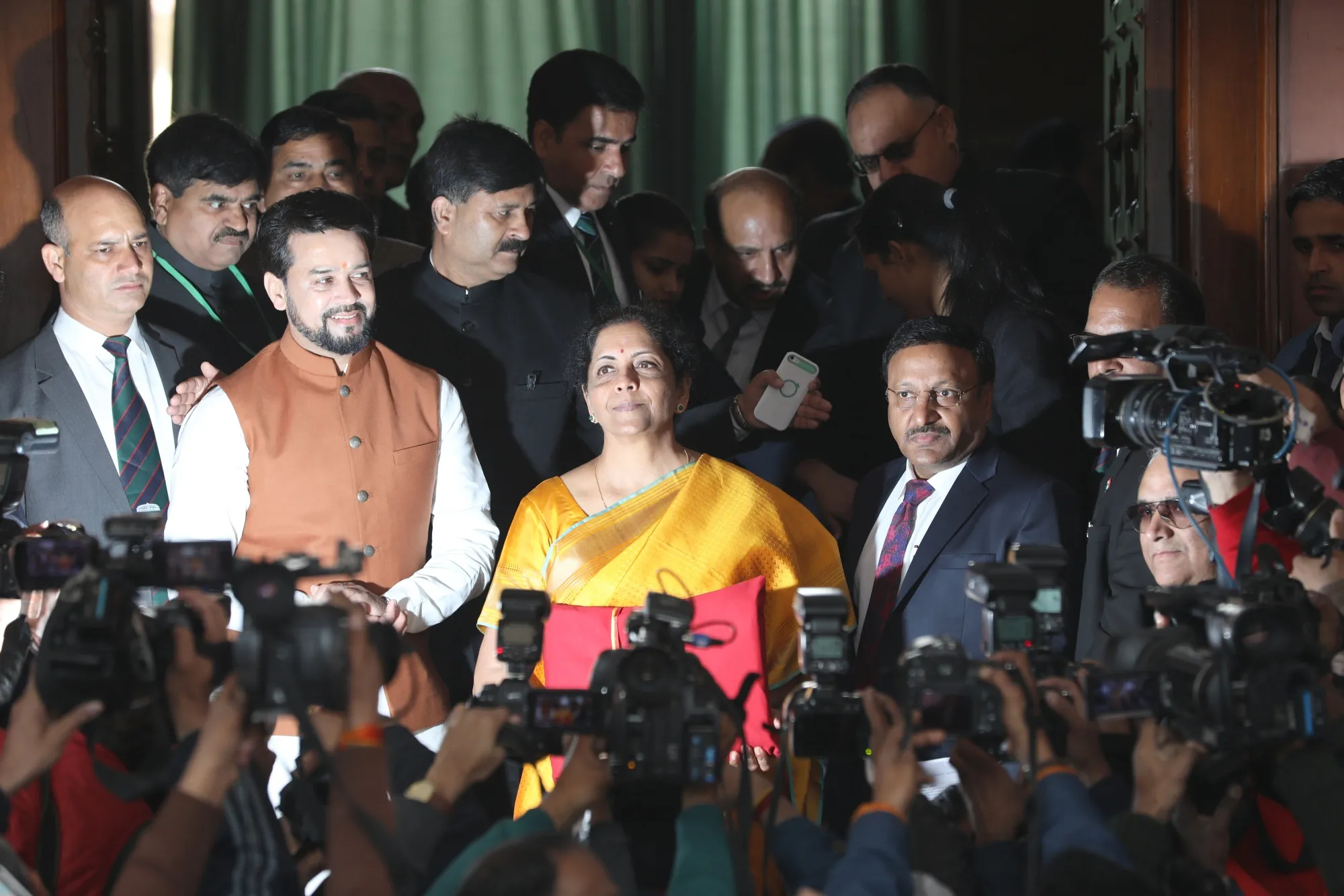 Nirmala Sitharaman and other members of the finance ministry stand&nbsp;outside parliament house in New Delhi, India, on&nbsp;Feb. 1.