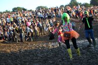 Beyonce Rocks, Bono Faces Demo, 180,000 Fans Get Muddy