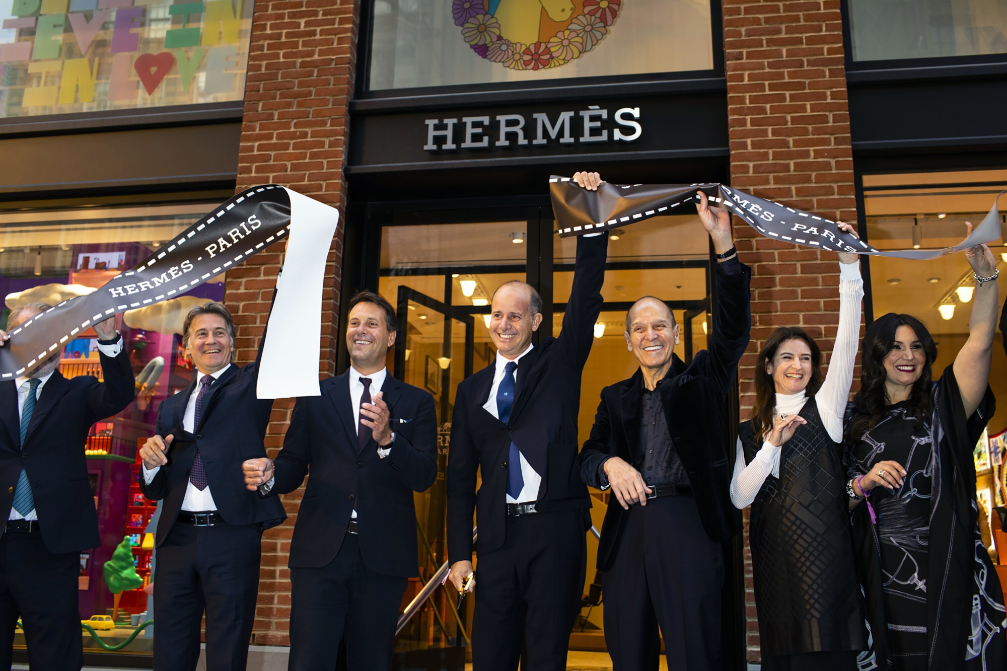 Pierre-Alexis Dumas, center, the brand's artistic director and the great-great-great grandson of Thierry Hermès, who founded the company in 1837, at the opening of the new Hermès flagship store in Manhattan, Sept. 29, 2022. (Landon Nordeman/The New York