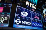 A monitor displays signage for Pfizer Inc., Eli Lilly and Co., AbbVie Inc. and Merck &amp; Co Inc. on the floor of the New York Stock Exchange (NYSE) in New York, U.S., on Monday, March 13, 2017.

