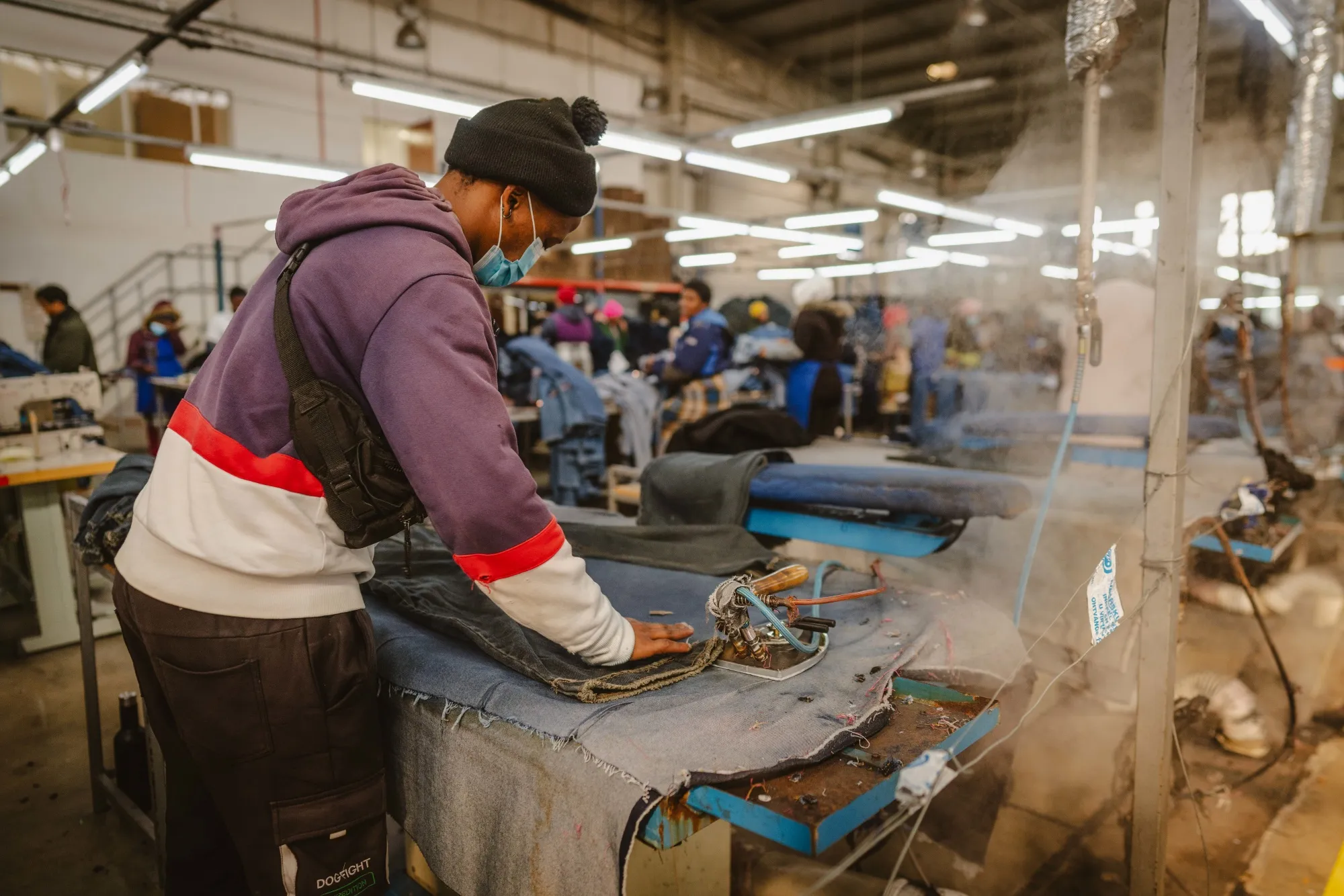 A worker irons denim cloth at a denim factory in Maseru, Lesotho on July 24.