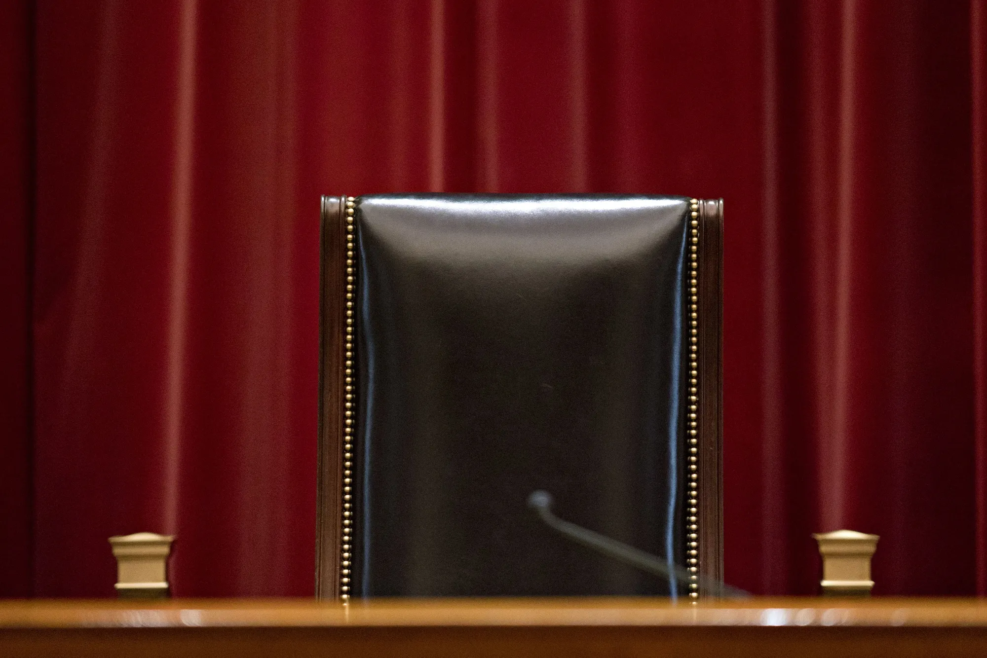 A Leather Chair In A Courtroom