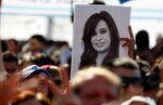 A man holds a drawing of former President Cristina Fernández at a September event in Buenos Aires marking the publication of her memoirs. 