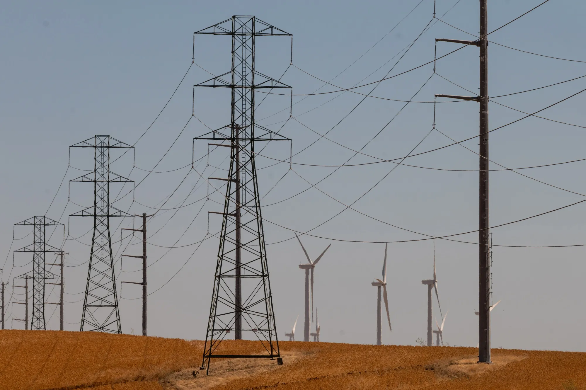 Power transmission lines and wind turbines in Rio Vista, California.