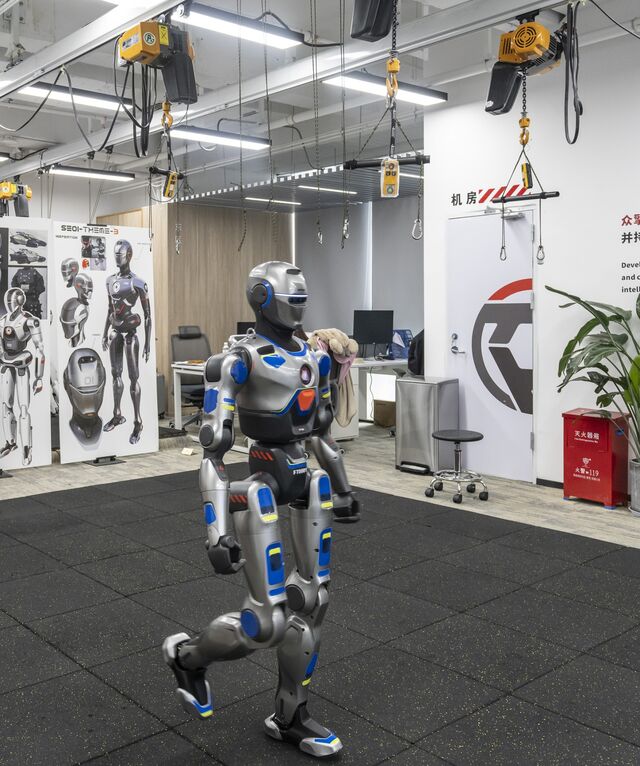 A PM01 humanoid robot. Zhao grew obsessed with figuring out how to create robots that could walk with a natural, human-like gait.
