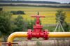 A valve wheel sits attached to crude oil pipework in an oilfield near Almetyevsk, Russia.