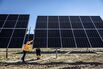 Workers install solar panels near Zaragoza, Spain. 