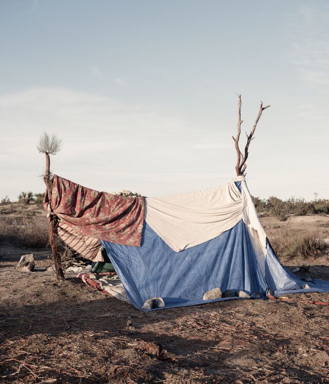 A makeshift migrant tent in the desert. 