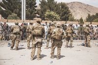 U.S. Soldiers and Marines assist with security at an Evacuation Control Checkpoint during an evacuation at Hamid Karzai International Airport in Kabul on Aug. 19.