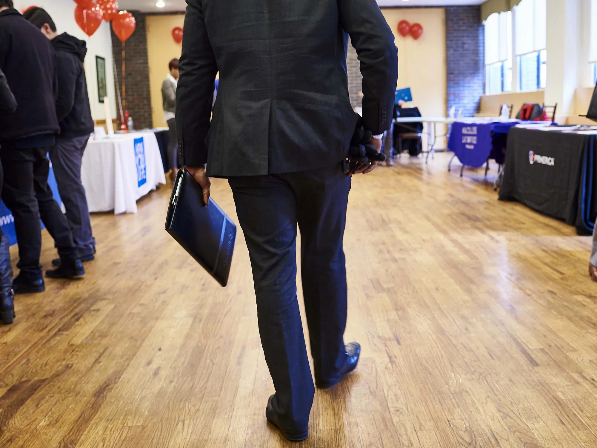 A job seeker arrives for a career fair in the Brooklyn borough of New York.