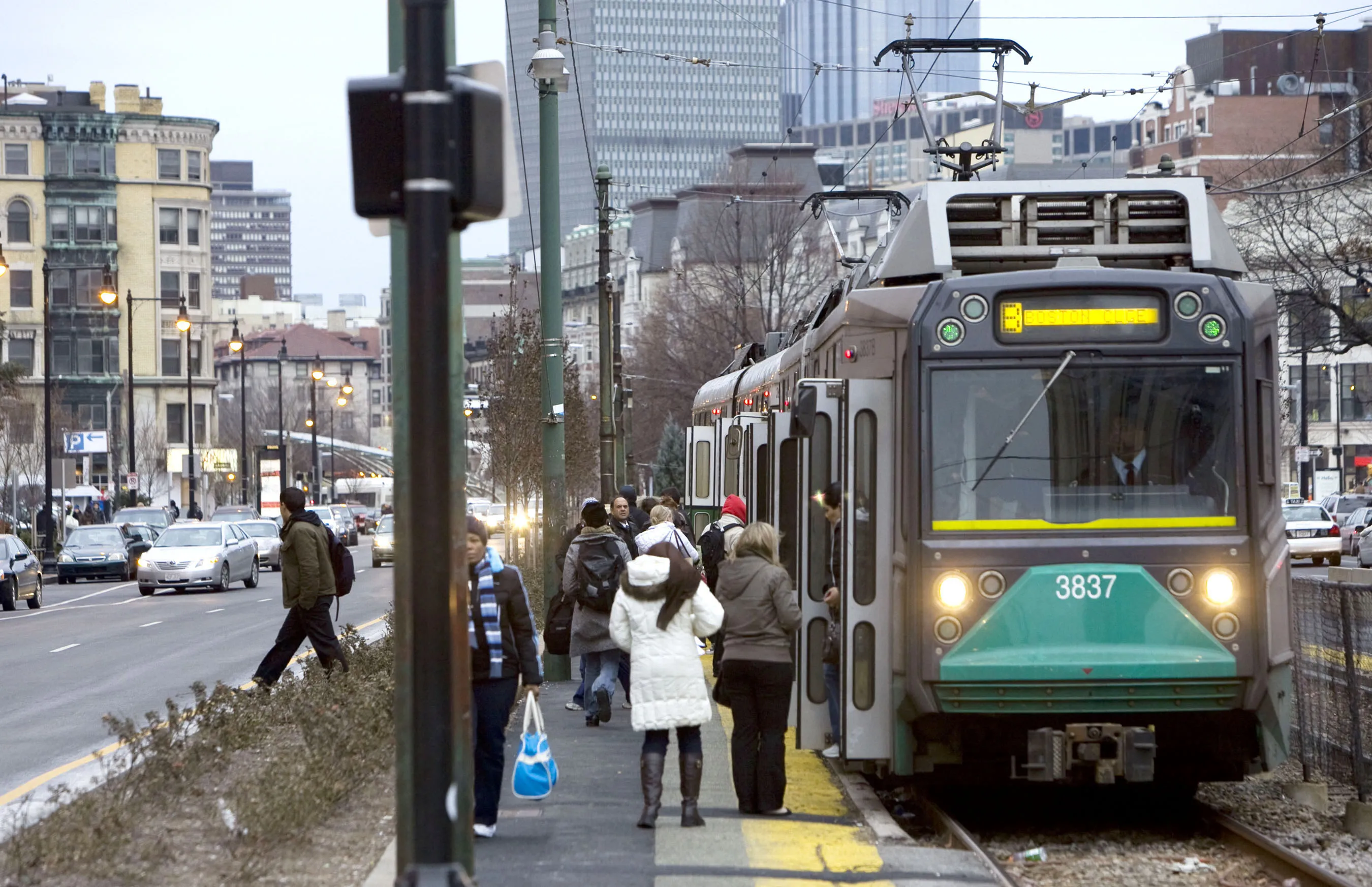 Commuters enter the green line subway train in Boston, Massachusetts.