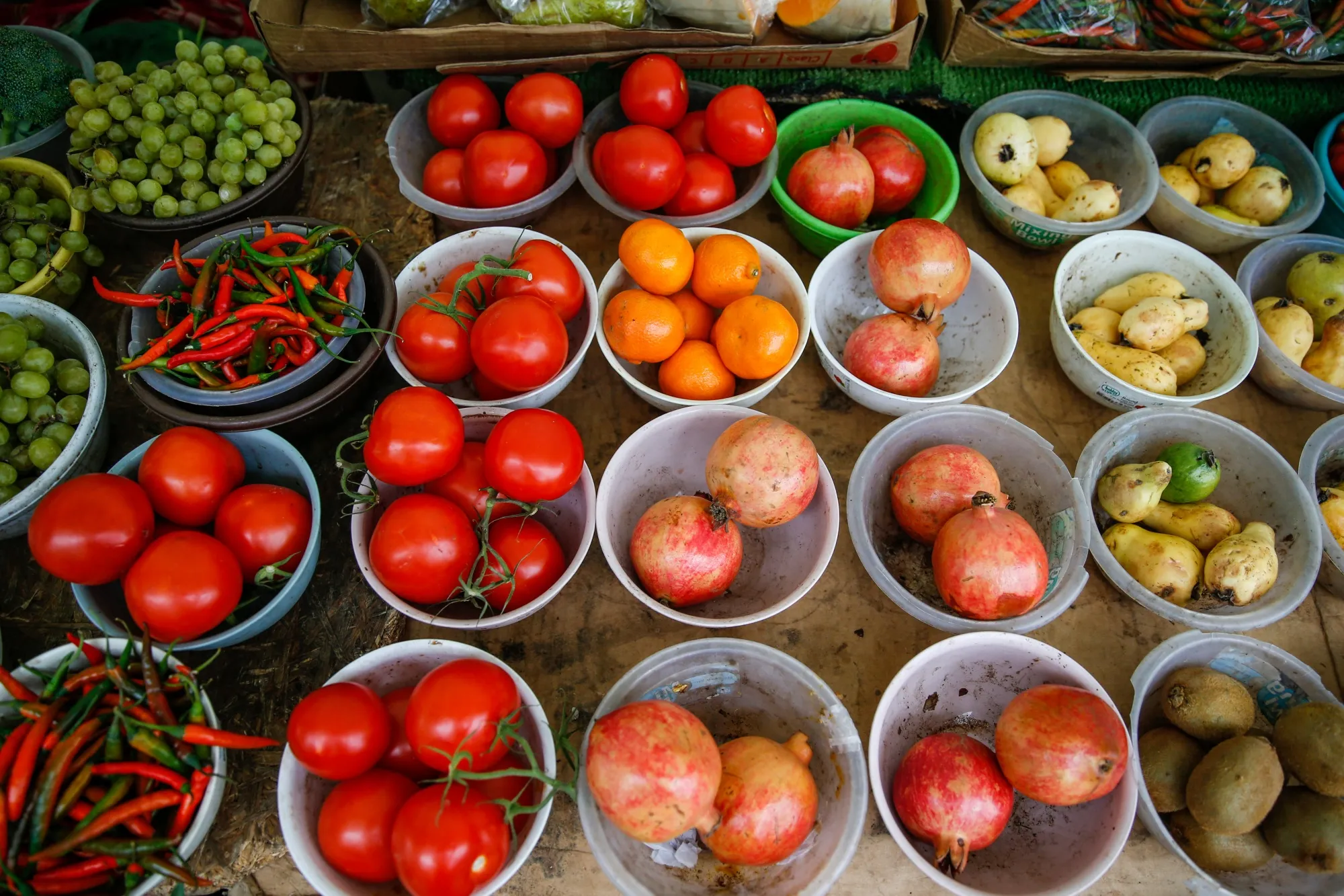 Fruit and vegetables sit on display at an outdoor market stall at Chrisp Street Market in&nbsp;London.