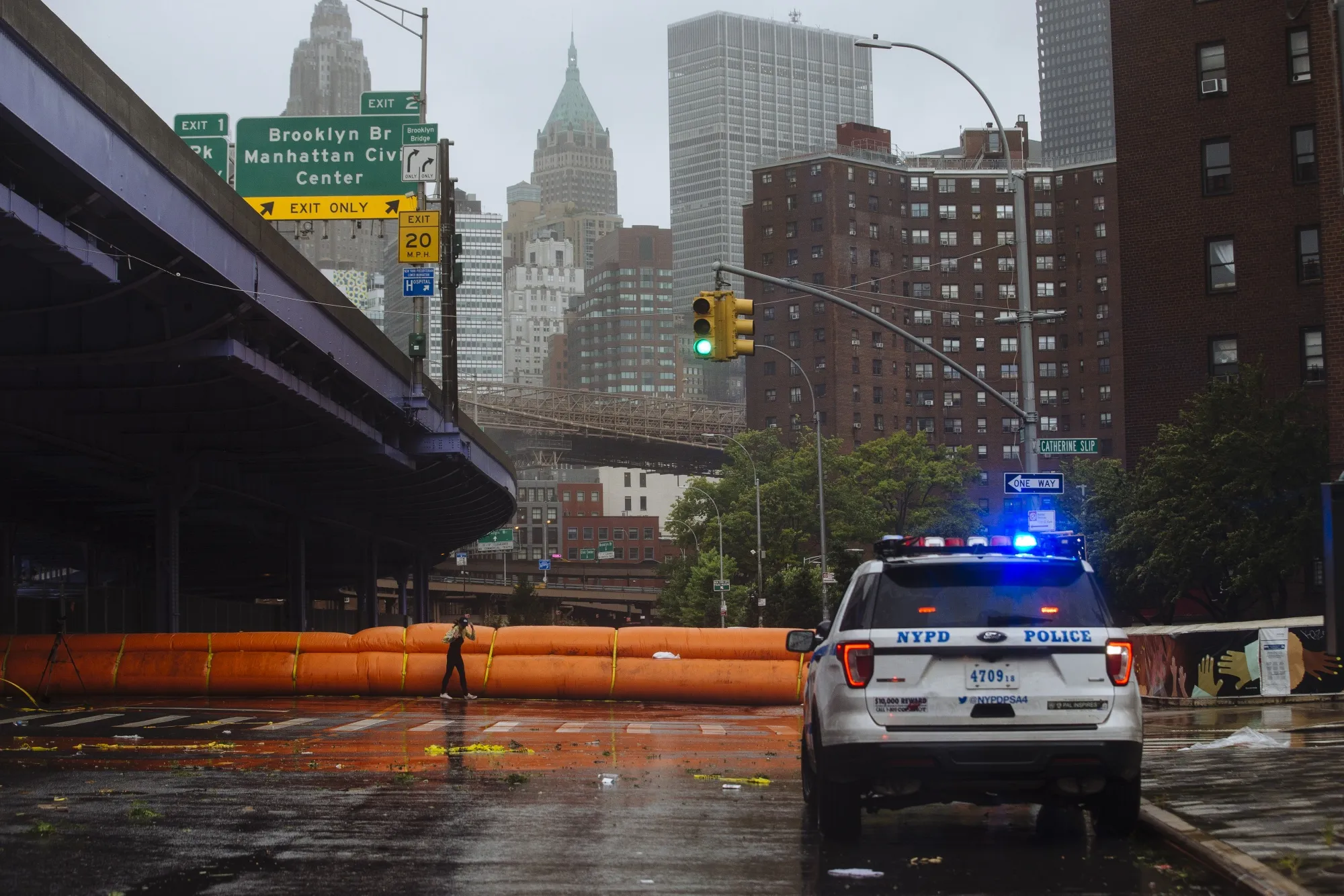 A flood barrier stretches across a street during Tropical Storm Isaias in New York on Aug. 4.