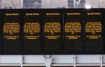 Screens displaying train cancellation information due to extreme weather during a heat wave at London King's Cross railway station in London, on July 19.