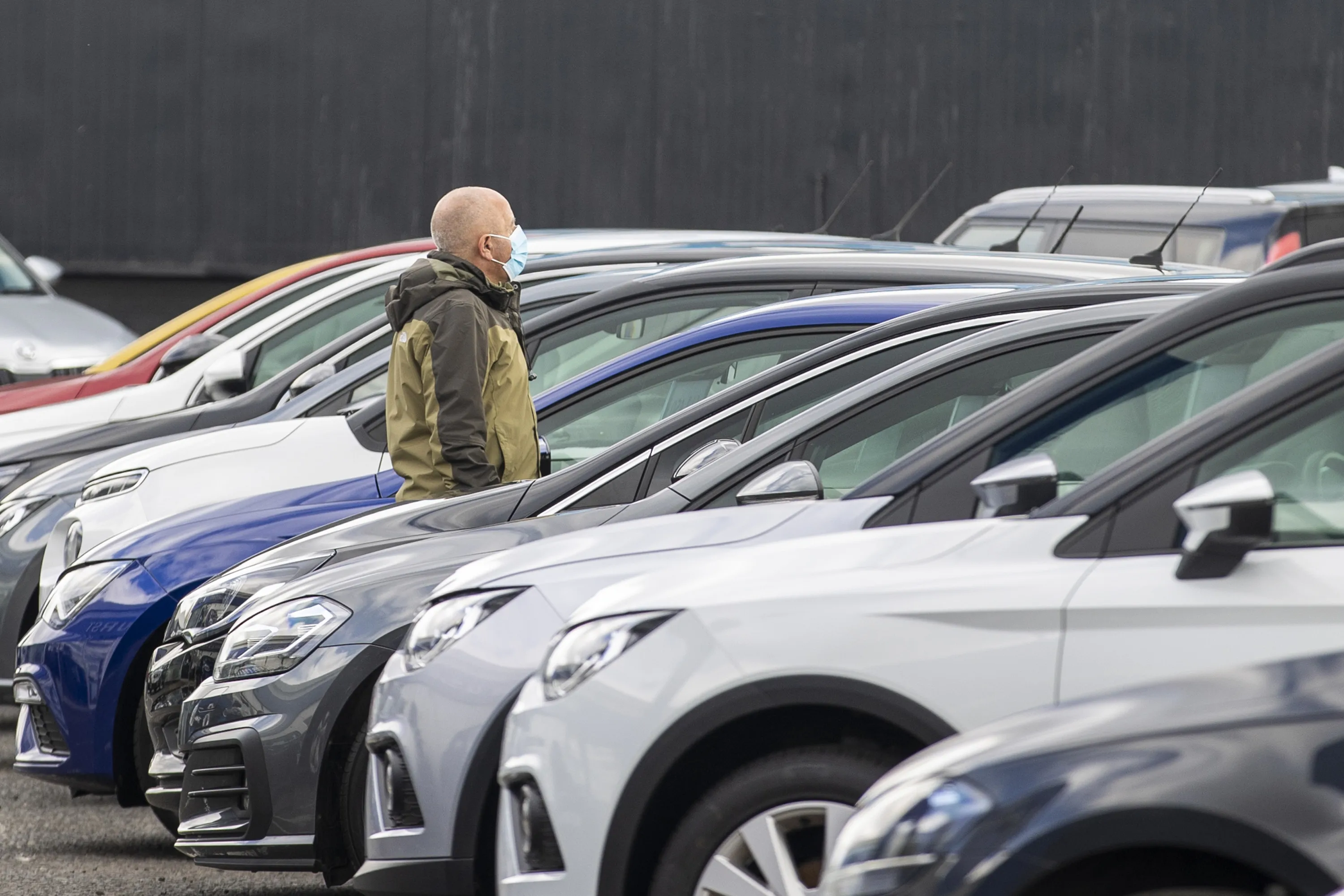 A visitor looks at used cars at a dealership&nbsp;in Belfast, Northern Ireland.&nbsp;