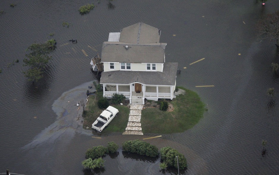 A home is surrounded by floodwaters from Hurricane Ike in Galveston, Texas September 13, 2008.
