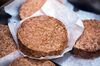 Uncooked Beyond Meat Inc. plant-based burger patties sit in the kitchen inside a TGI Friday's Inc. restaurant。