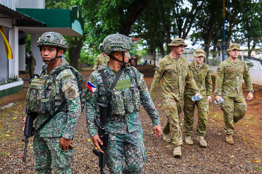 Filipino and Australian military soldiers during the start of military exercise 'ALON 2025', at a military base in Palawan, Philippines.