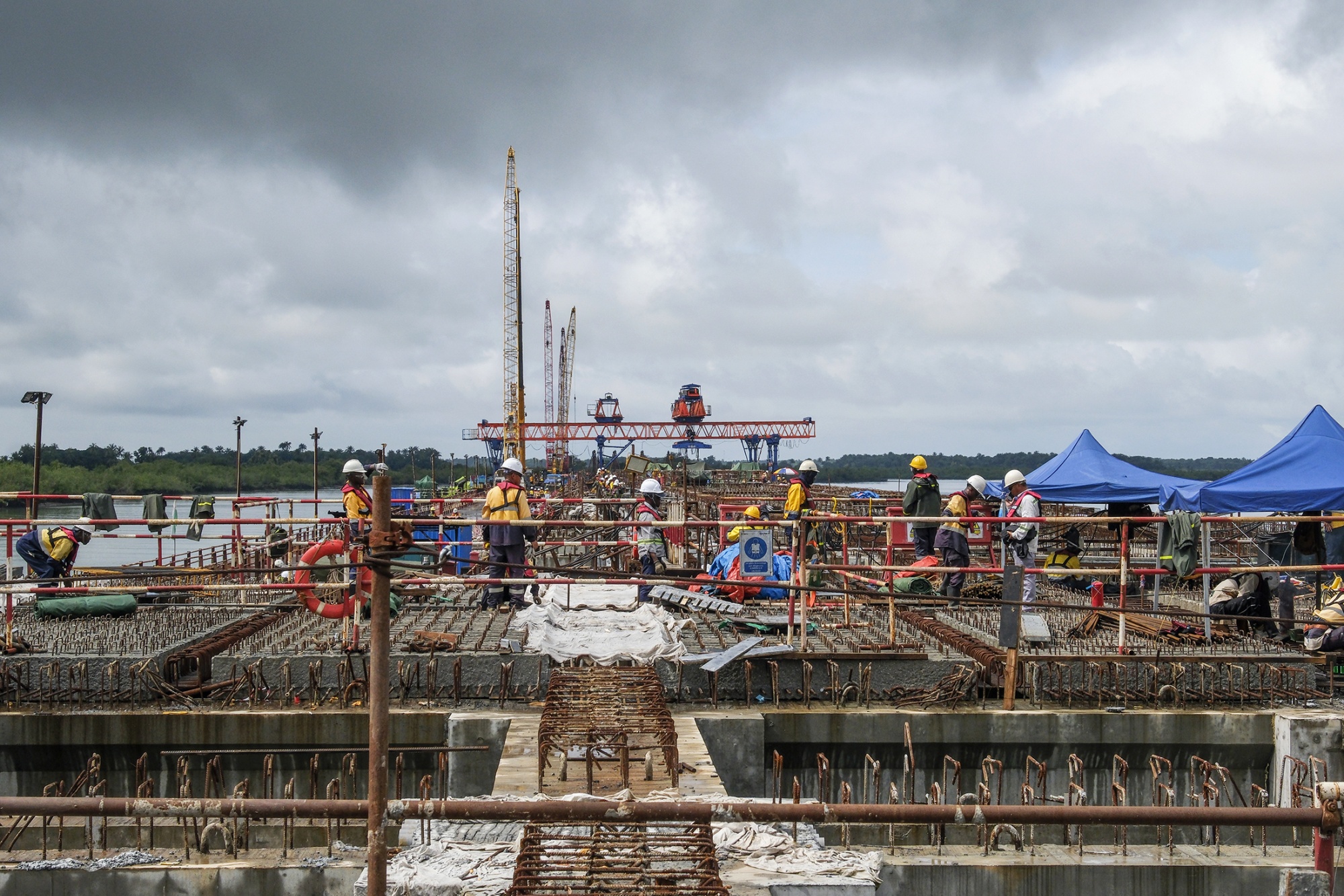 Mafrinyah, Guinea (September 2, 2025) - The Morebaya Port in Guinea is being built at Guinea's Atlantic Ocean Coast. It will be the end stop of 600-kilometres rail line built to ship iron-ore from Simandou to the coast. Photographer: Ricci Shryock/Bloomberg