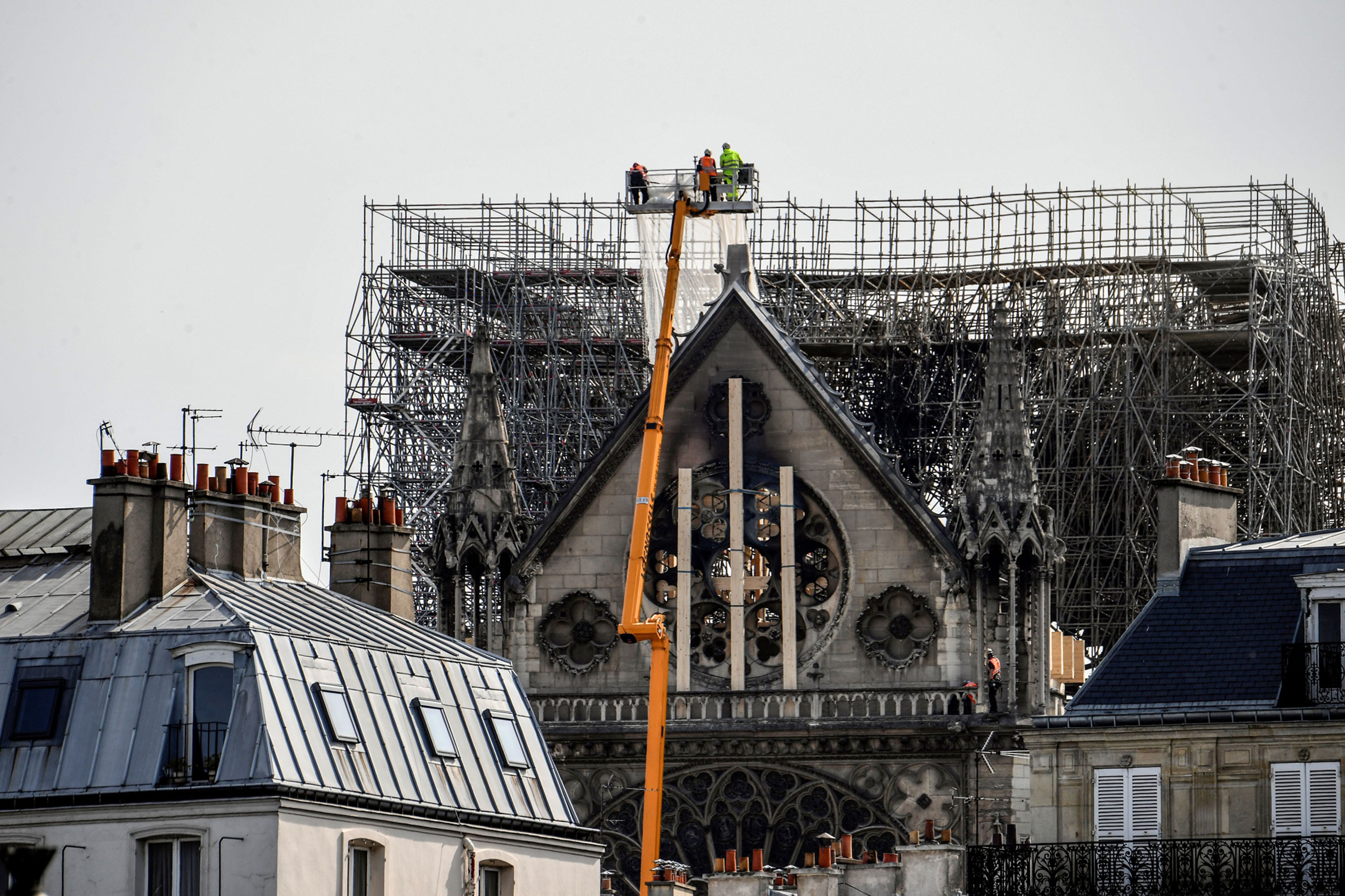 Workers on the northern side of Notre-Dame Cathedral on April 18.