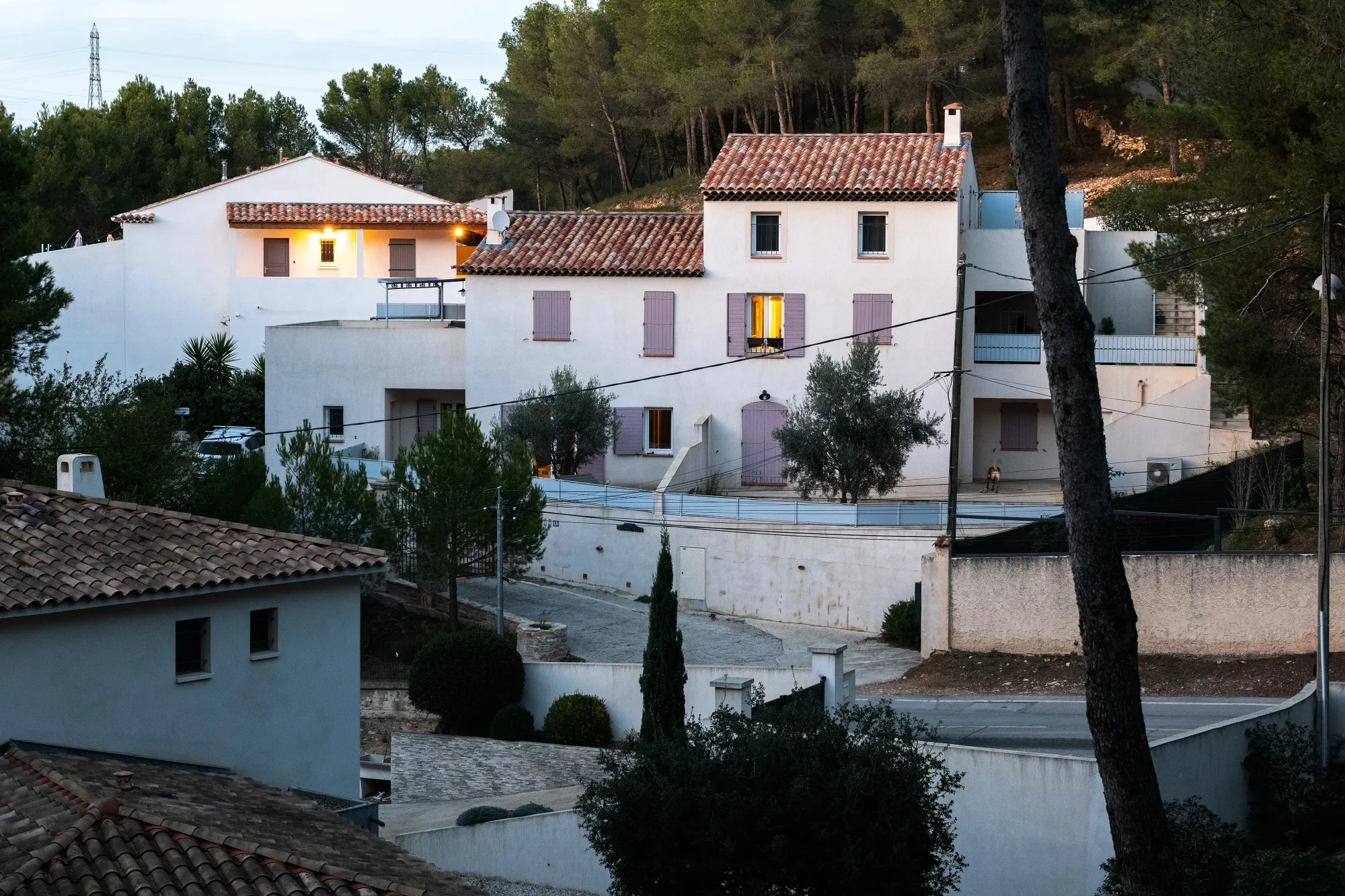 Lights on inside homes in Septemes-les-Vallons, France.