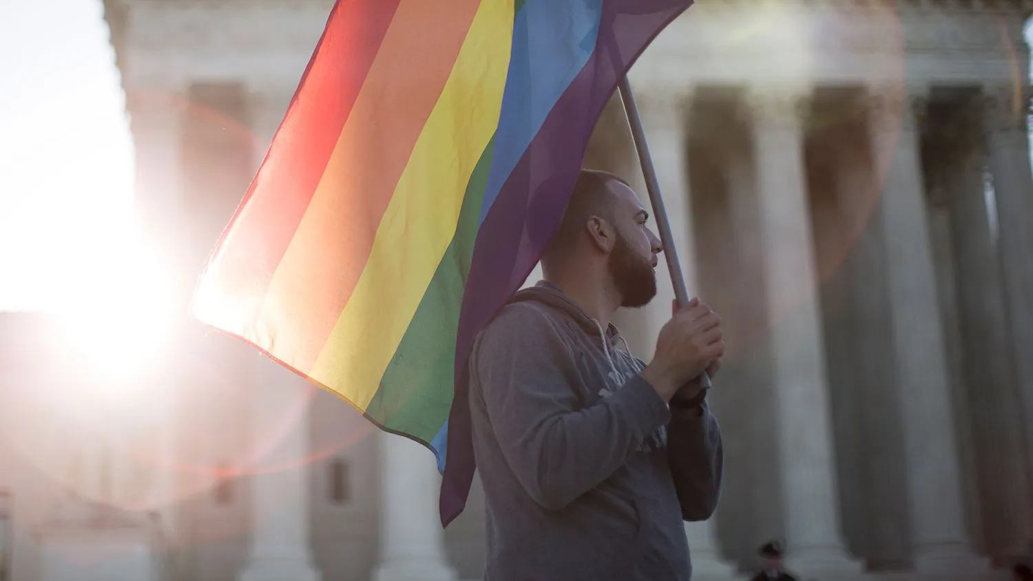 Same-sex marriage supporter Vin Testa, of Washington, DC, holds a rainbow pride flag near the Supreme Court, April 28, 2015 in Washington, DC.
