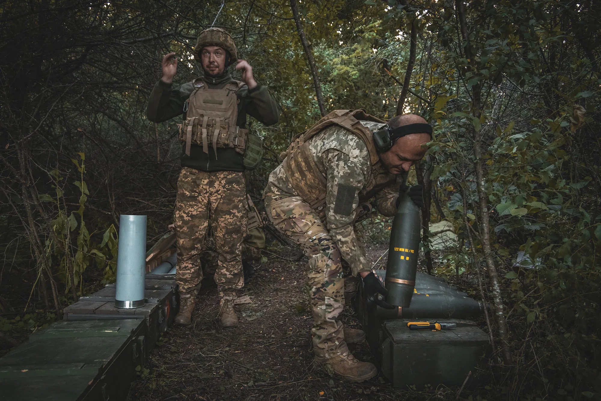 Artillerymen prepare a projectile for combat operations at an artillery position in the Sumy region of Ukraine on June 19.
