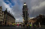 A rainbow appears in the sky near Portcullis House, left, and the Houses of Parliament, right, in London, U.K.