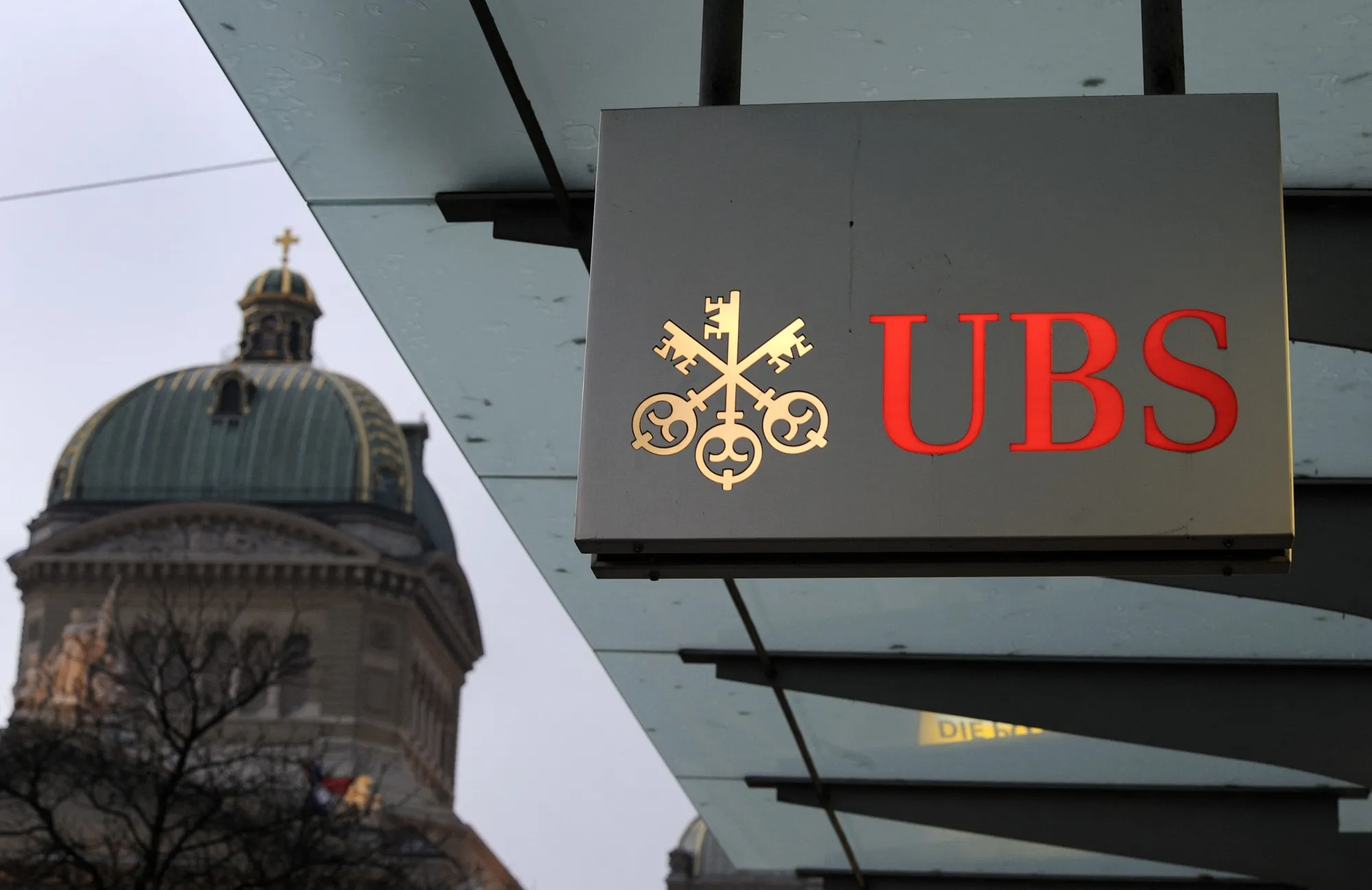 The cuts were originally slated for September but were postponed as a result of the Credit Suisse merger.&nbsp;