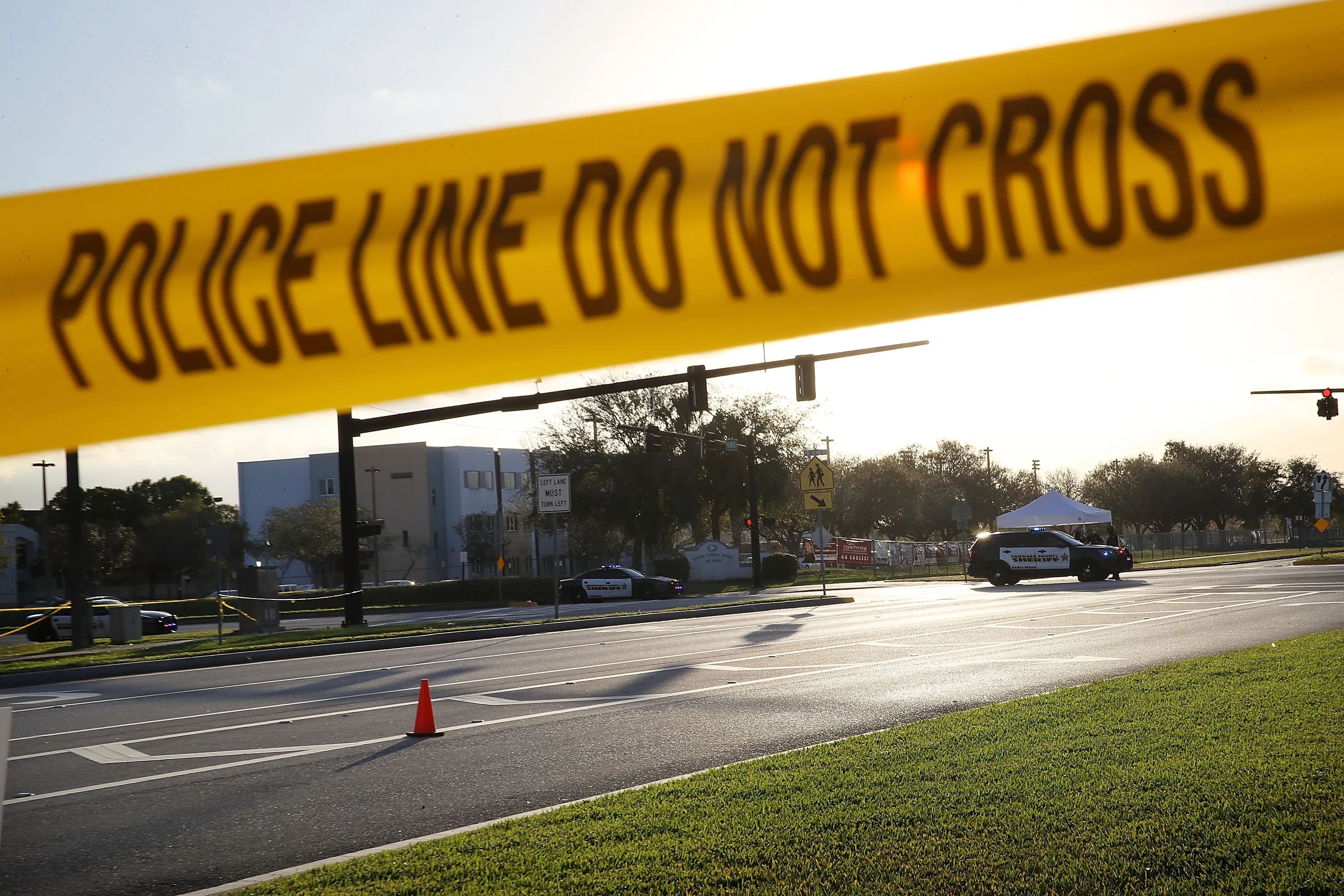 Police officers are seen in front of Marjory Stoneman Douglas High School as law enforcement officials continue their work investigating on Feb. 17.