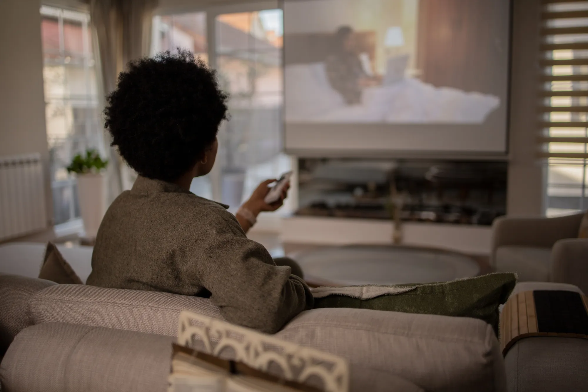 Woman enjoying her favorite TV show at home