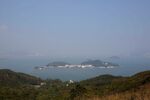 The view east from Lantau Island to Peng Chau, Kau Yi Chau, and other smaller islands, with Hong Kong Island in the distance.
