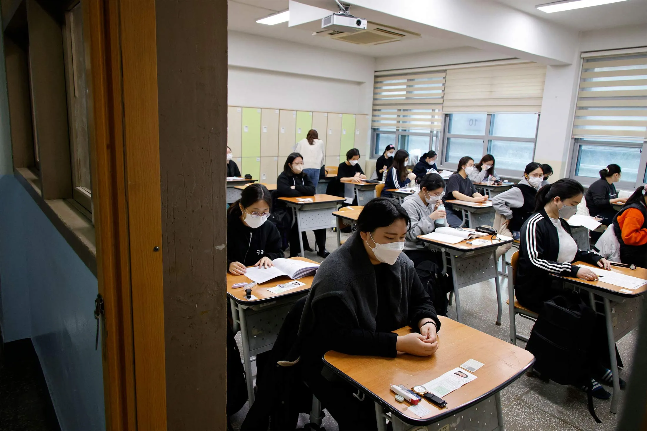 Students wait for the start of the annual college entrance examinations at an exam hall in Seoul on Nov. 17, 2022.&nbsp;