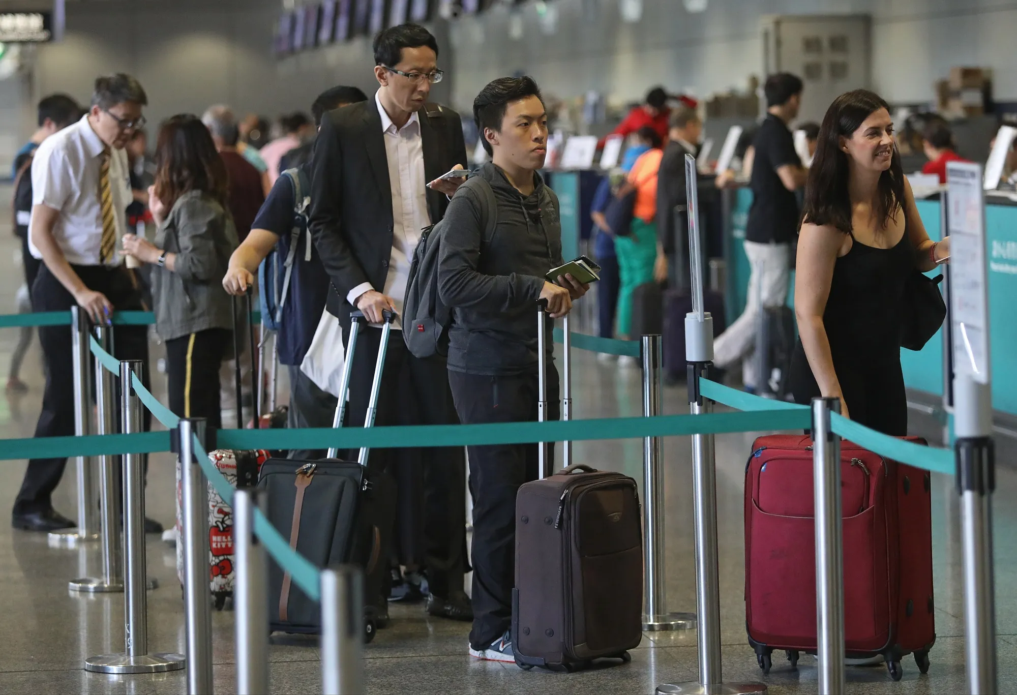 Passengers check-in at counters in&nbsp;Hong Kong Station