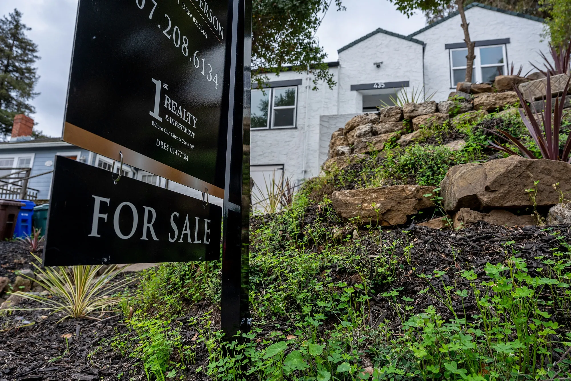 A "For Sale" sign in front of a home in Crockett, California.