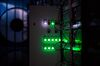 Green light illuminates the cases of mining rigs operating inside a shipping container converted into a mobile cryptocurrency mining farm, operated by BitCluster, at Rodniki Industrial Park in Rodniki, Russia.