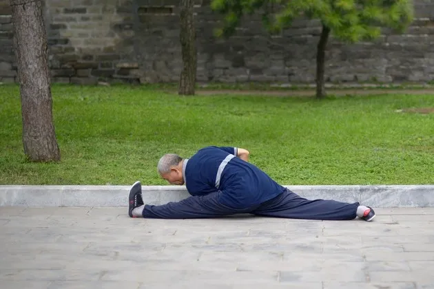 A man exercises in a Beijing park on Sept. 26
