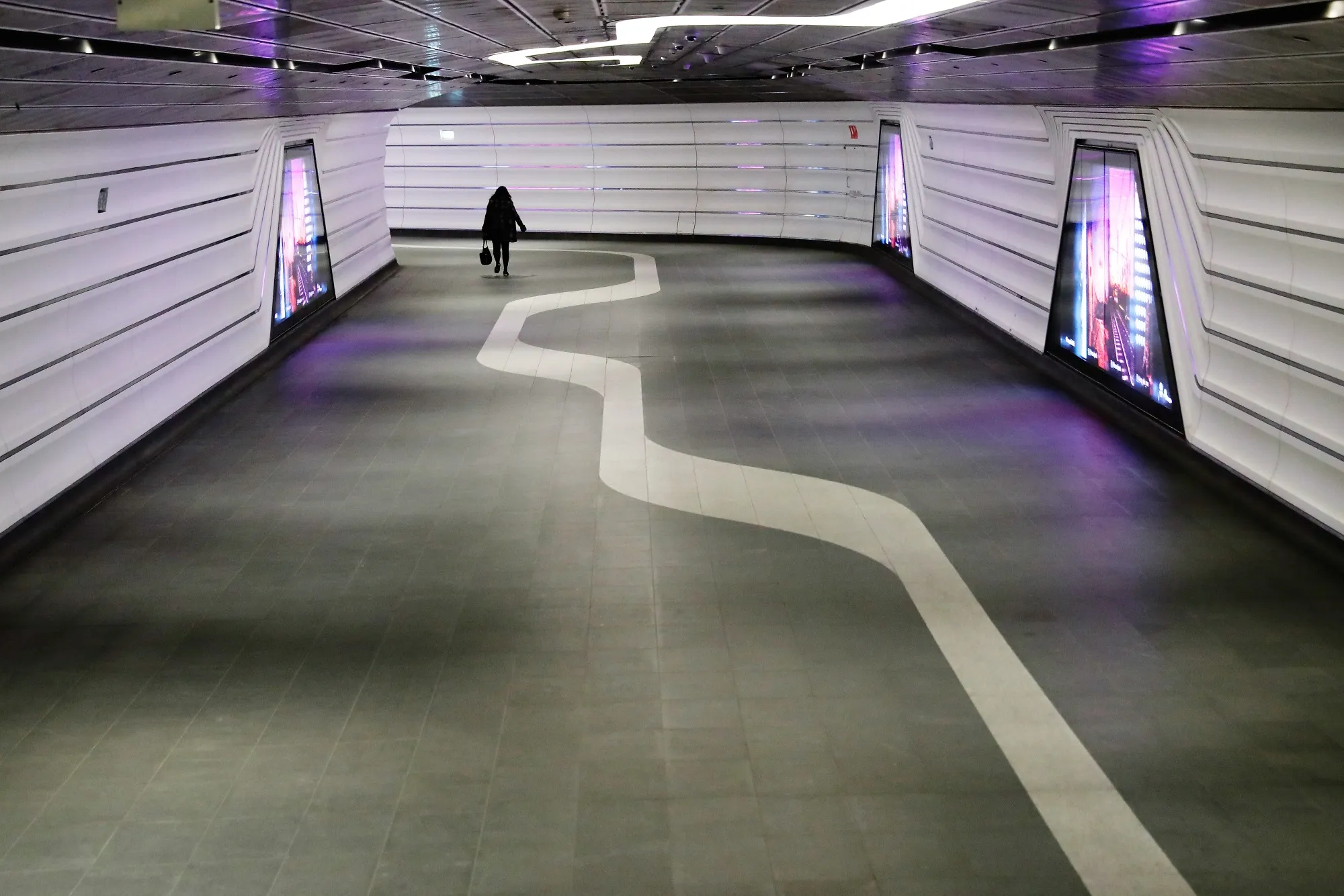 A pedestrian uses a deserted public walkway in Sydney on May 5.&nbsp;