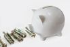 White piggy bank eating USA dollars one at a time, financial