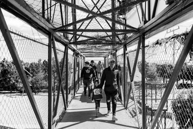The Tonito family walks across a bridge from Ciudad Juárez, Mexico, into the US, on April 10.  