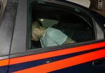 A man who was allegedly questioned in the case of a slain Carabinieri policeman is seen on a Carabinieri car&nbsp;in Rome&nbsp;July 27.