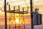 Power lines and transmission towers at sunrise in Crockett, California.