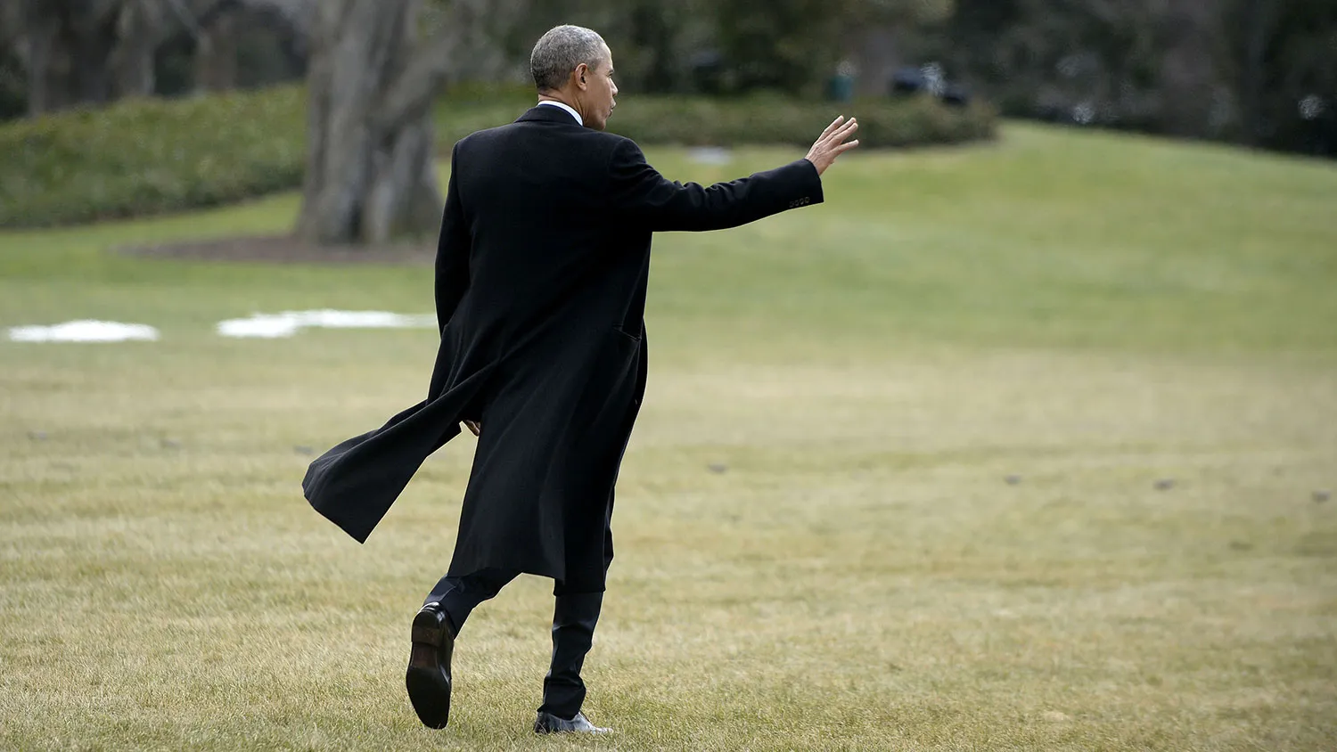 President Barack Obama waves as he walks out of the residence toward Marine One while departing the White House on Feb. 10, 2016 in Washington.

